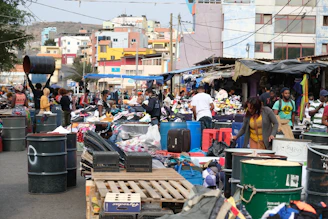 a group of people standing around a market