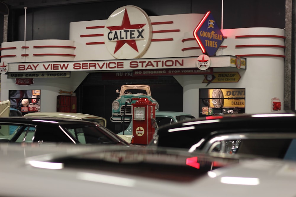 a car dealership with cars parked in front of it