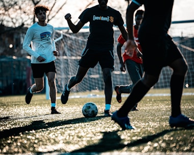 a group of young men playing a game of soccer