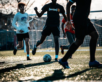 a group of young men playing a game of soccer