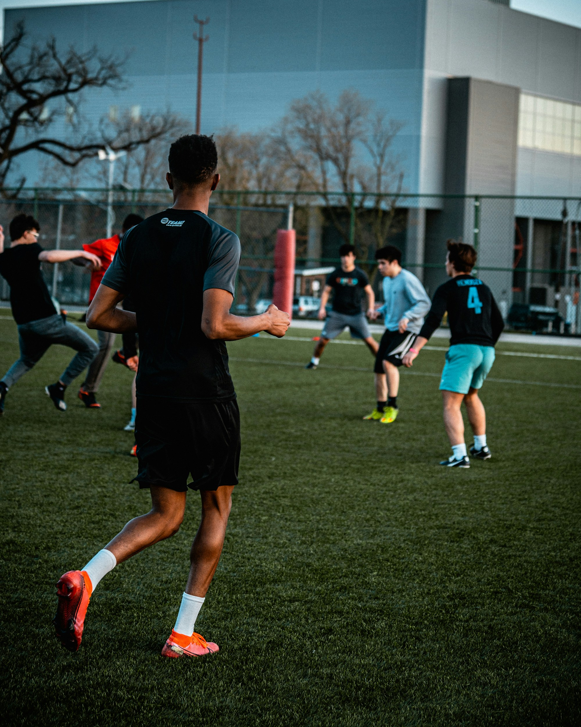 a group of young men playing a game of frisbee