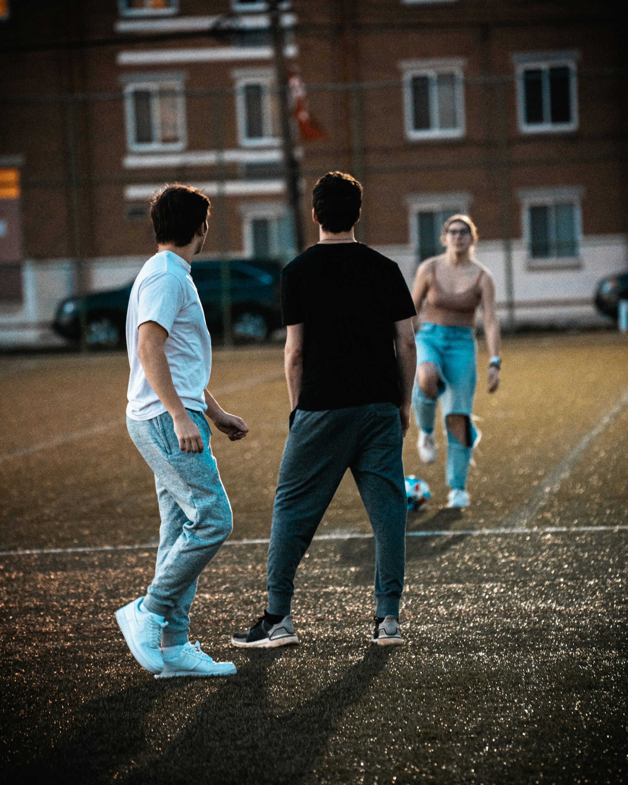 a group of young men playing a game of frisbee