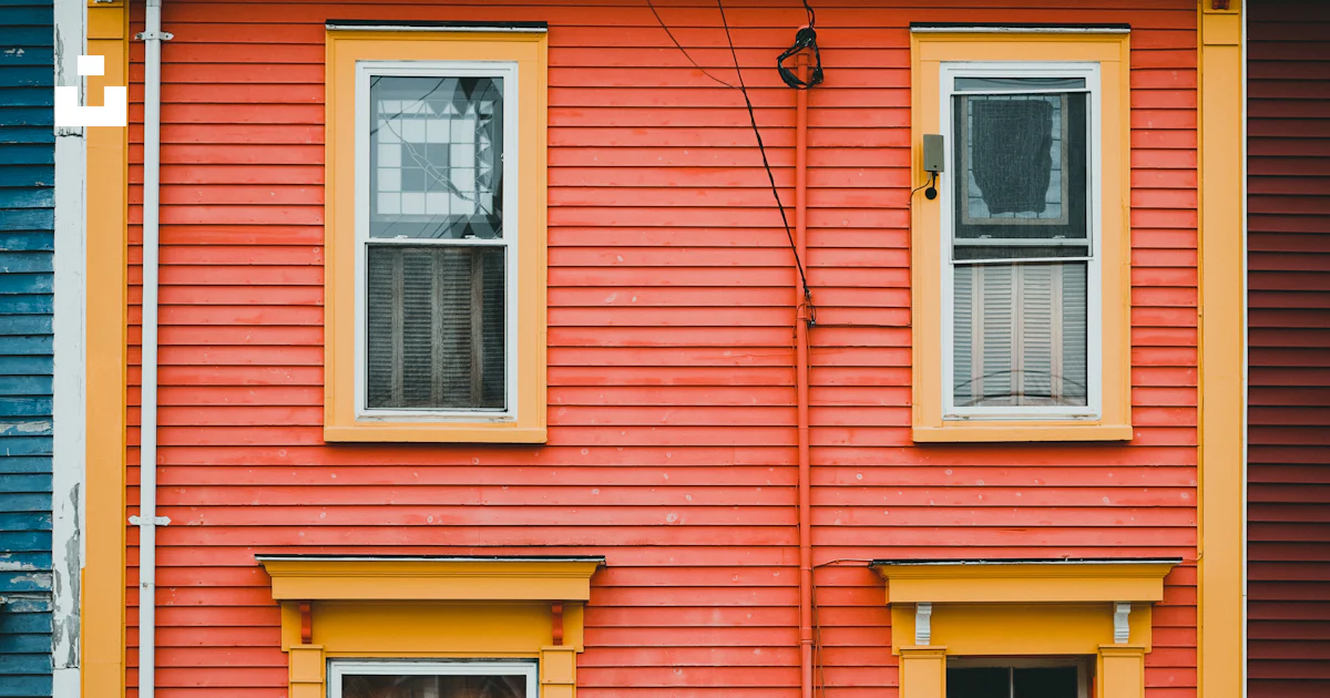 A red building with a blue door and windows photo – Free Canada Image ...