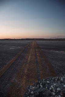 A close-up shot of a freshly rejuvenated runway surface glistening under the morning sun.