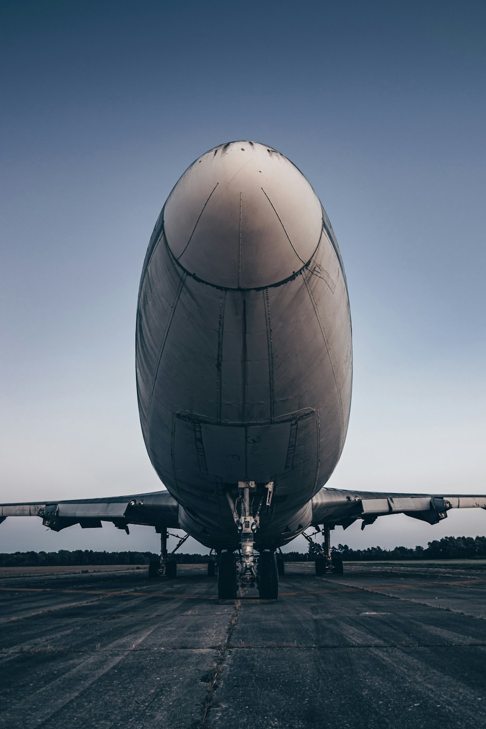 a large jetliner sitting on top of an airport tarmac