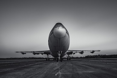a large jetliner sitting on top of an airport tarmac