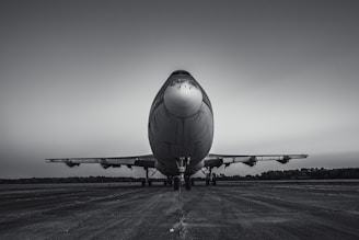 a large jetliner sitting on top of an airport tarmac