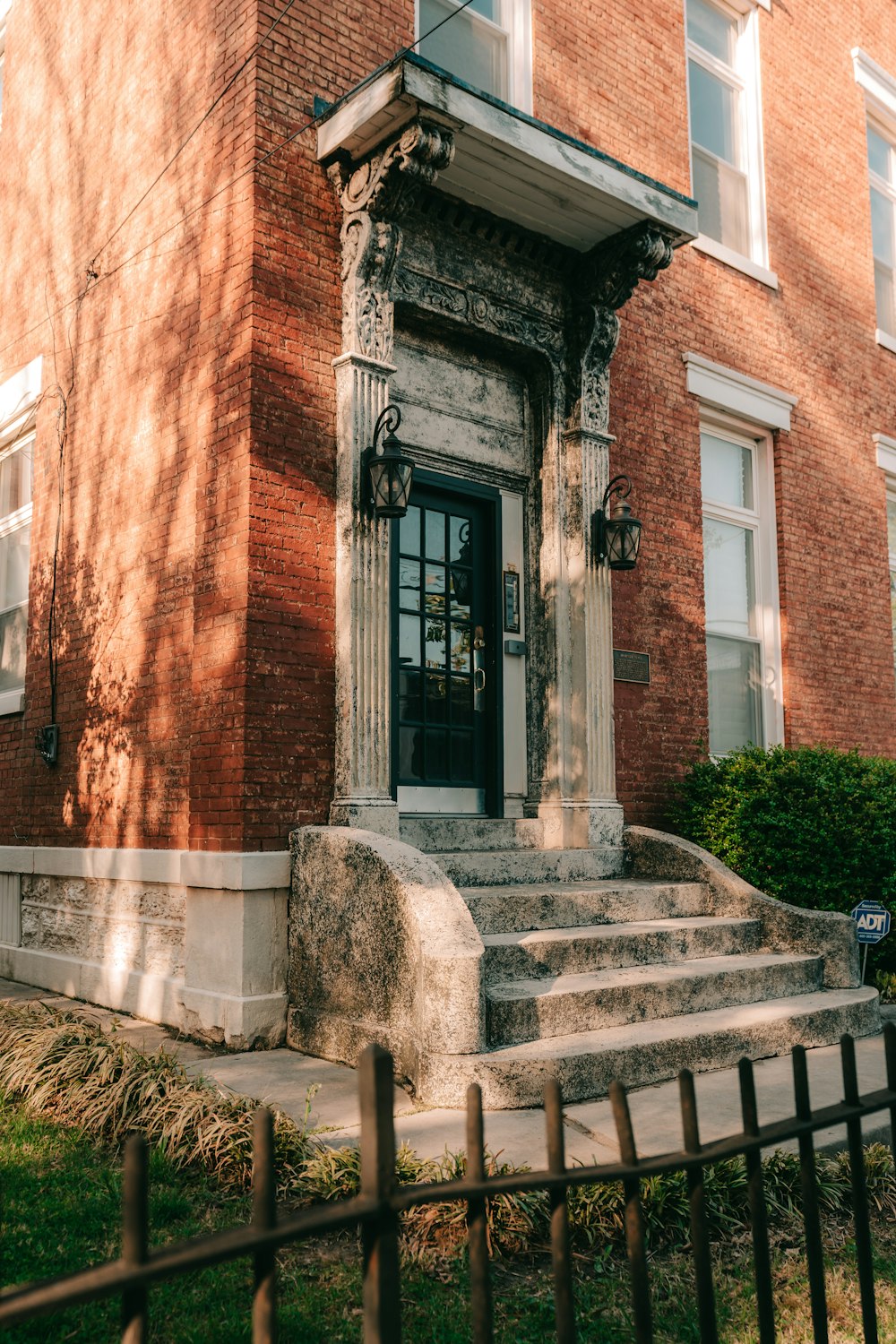 a large brick building with a black door