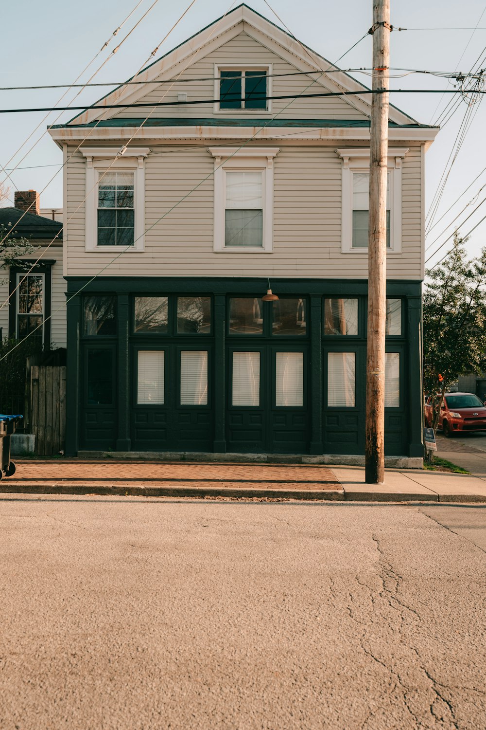 a street corner with a building and telephone pole