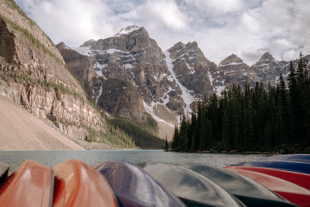 a group of canoes sitting on top of a lake