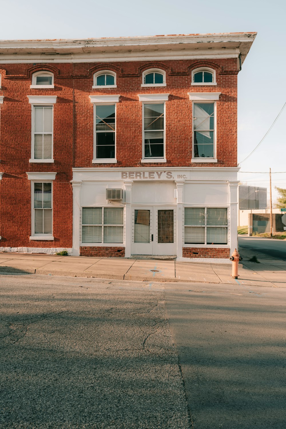 a red brick building sitting on the corner of a street