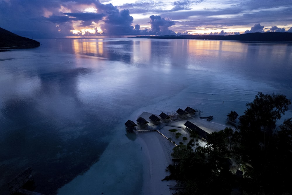 an aerial view of a beach at dusk