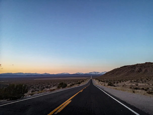 a long road in the middle of a desert