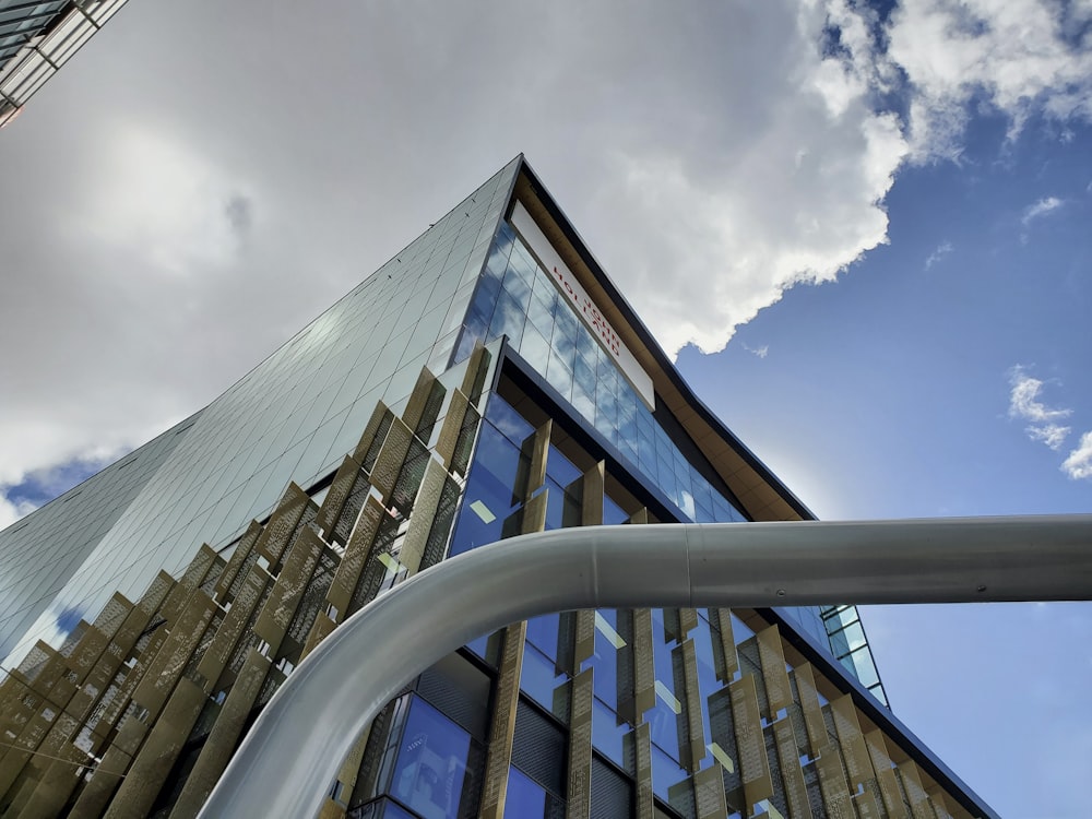 a very tall building with a sky background