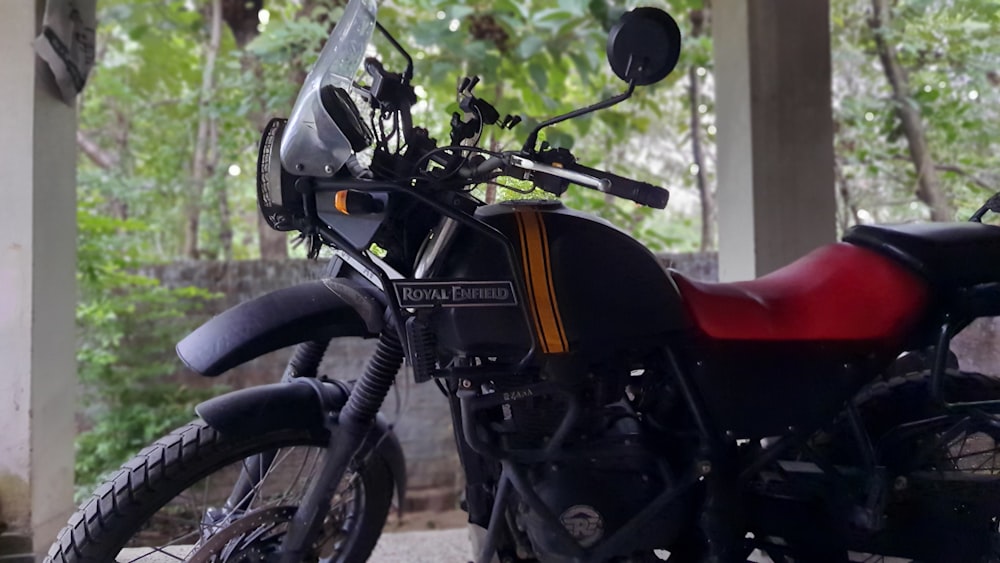 a motorcycle is parked under a covered area