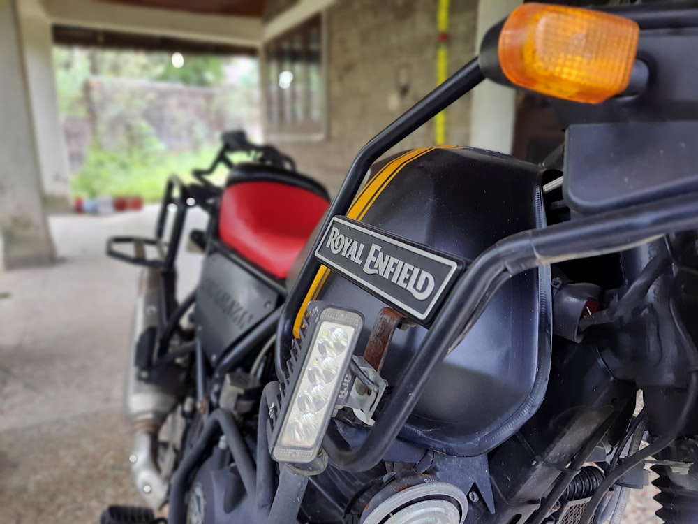 a close up of a motorcycle parked in a garage