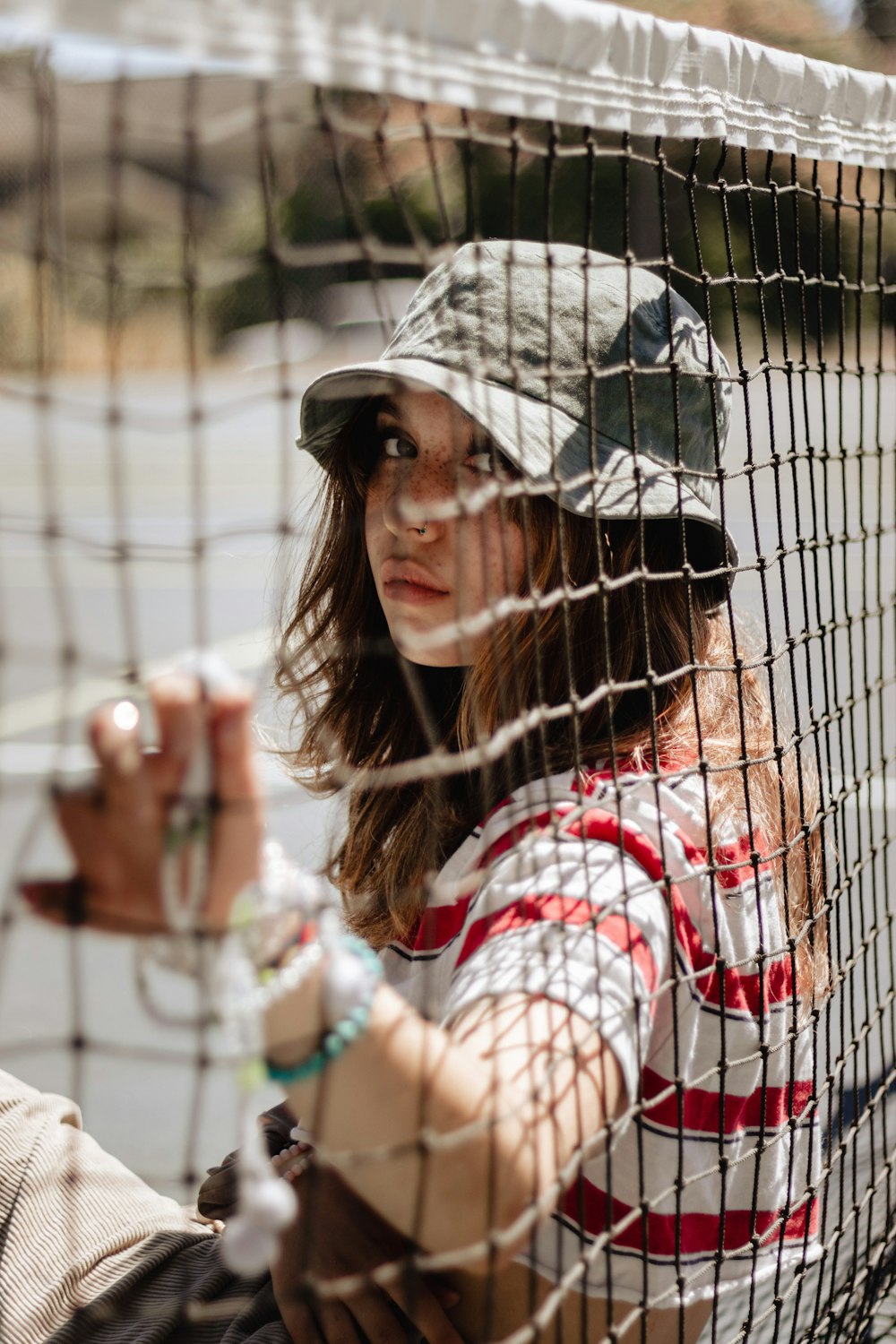 a woman holding a tennis racquet on top of a tennis court