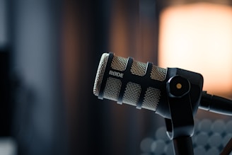 a close up of a microphone with a light in the background