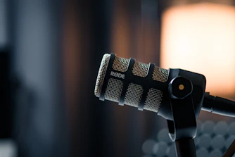 a close up of a microphone with a light in the background