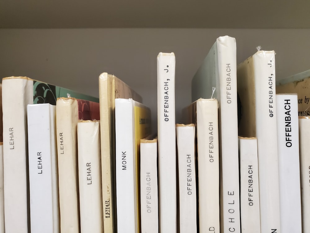 a close up of a row of books on a shelf