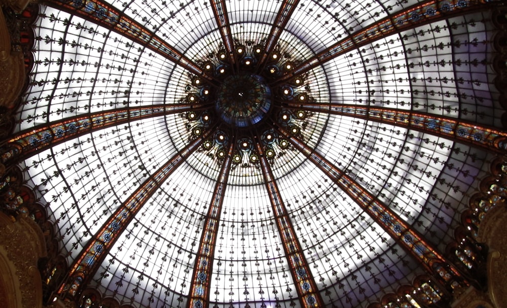 the ceiling of a building with a glass dome