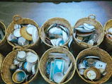 a bunch of baskets filled with different types of dishes
