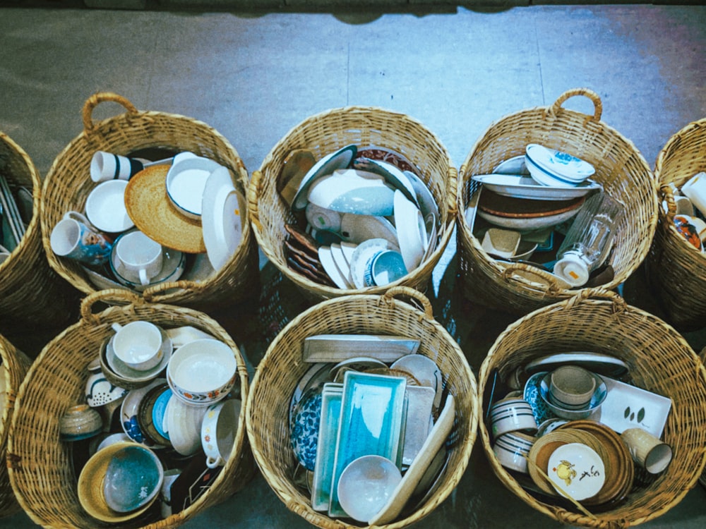 a bunch of baskets filled with different types of dishes