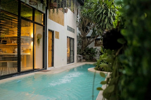 a swimming pool in front of a house