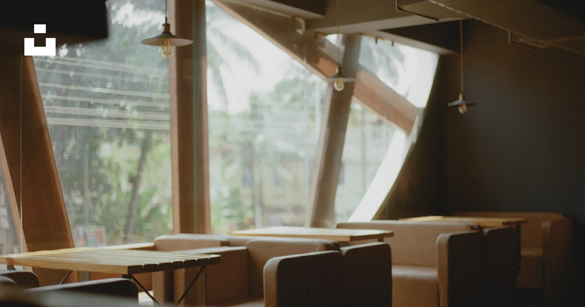 A row of tables sitting next to a window photo – Free Sunlight Image on ...