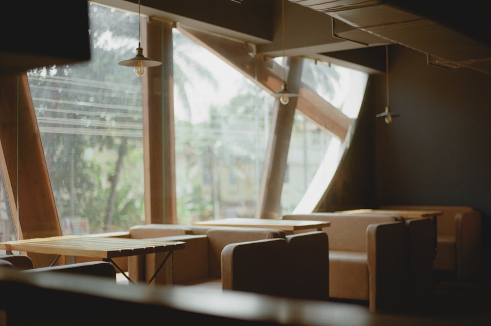 a row of tables sitting next to a window