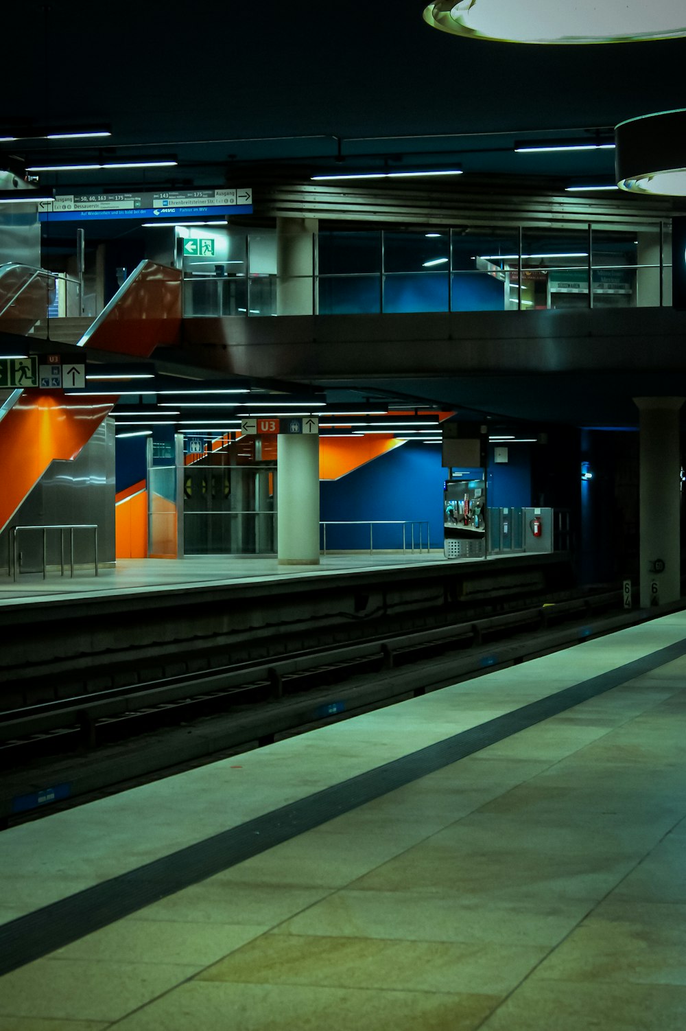 a train station with a train on the tracks