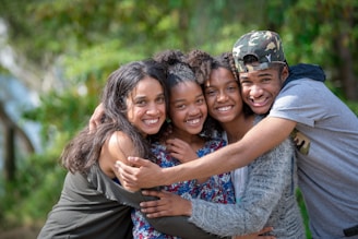 a group of young people hugging each other