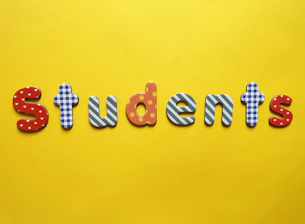 a yellow background with the word students spelled out