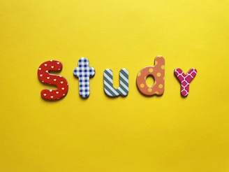 a yellow background with the word study spelled out