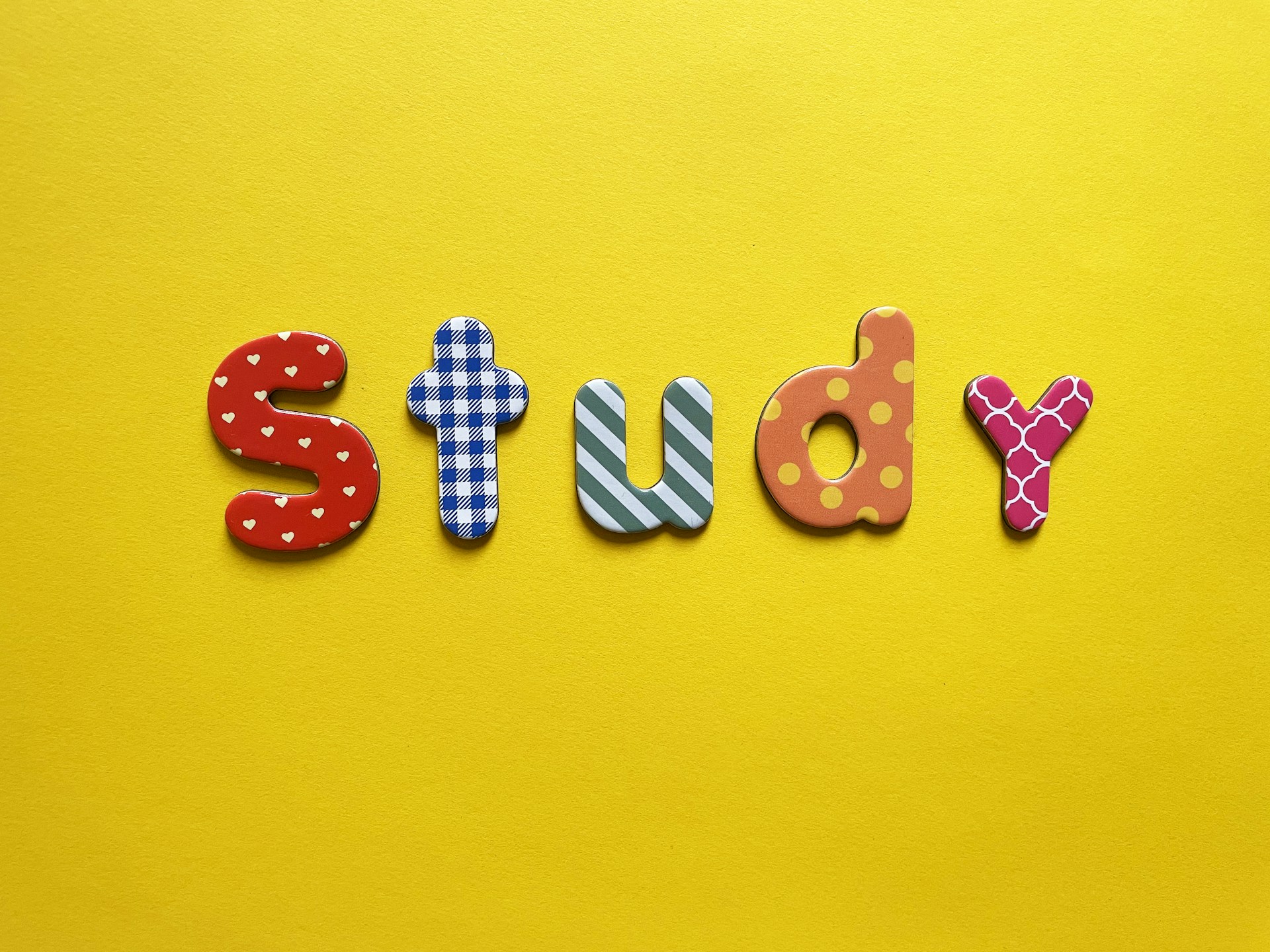 a yellow background with the word study spelled out