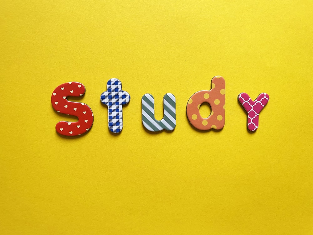a yellow background with the word study spelled out
