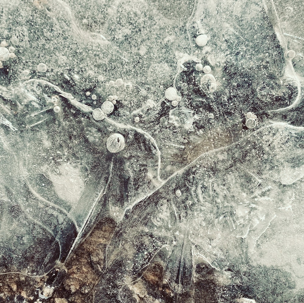 a close up of some ice on the ground