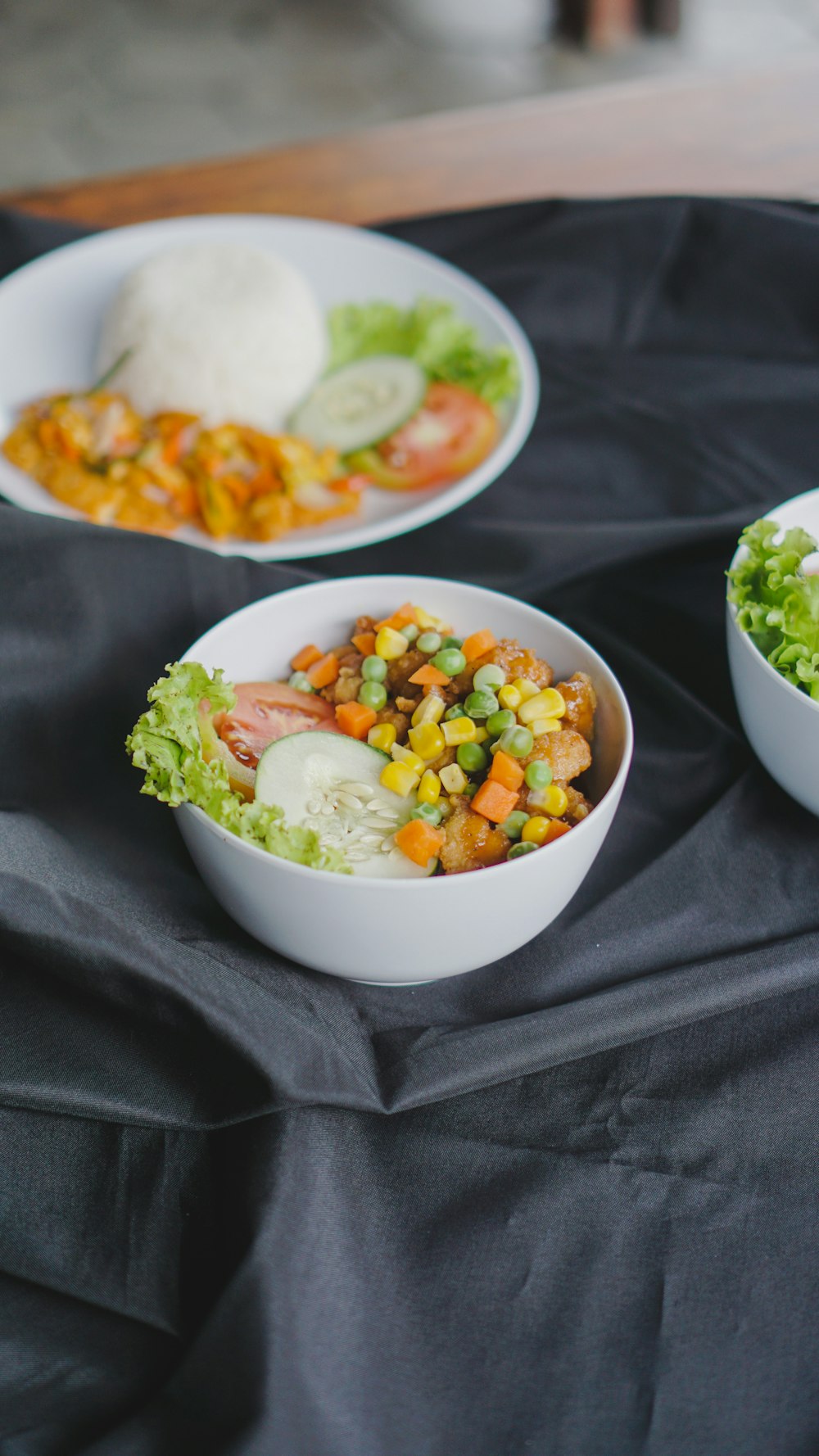 a table topped with bowls of food on top of a table