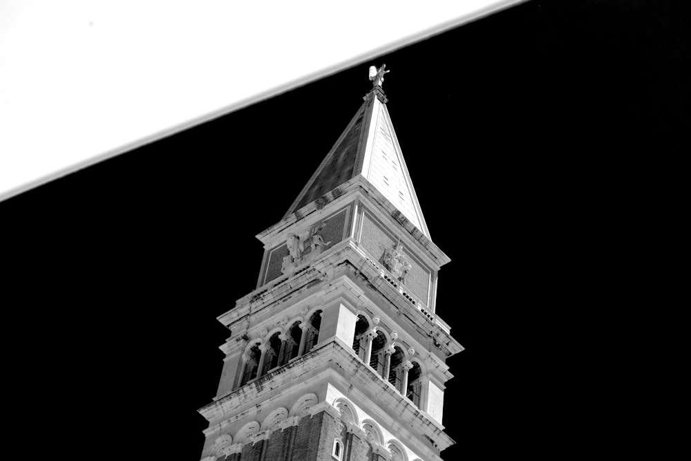 a black and white photo of a clock tower