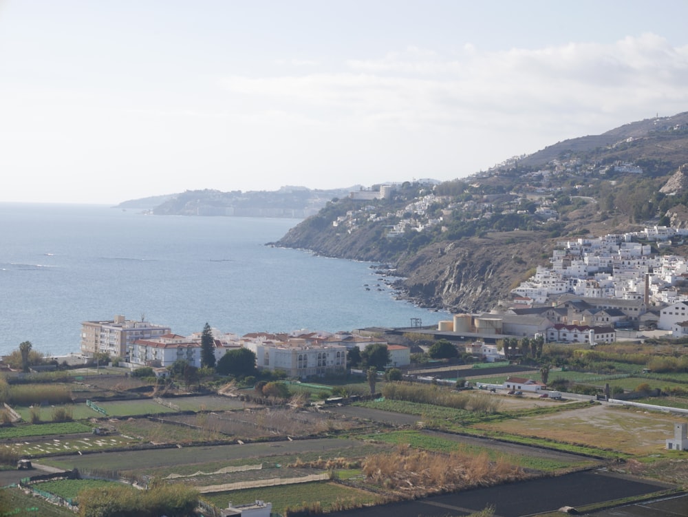 a view of a town and a body of water