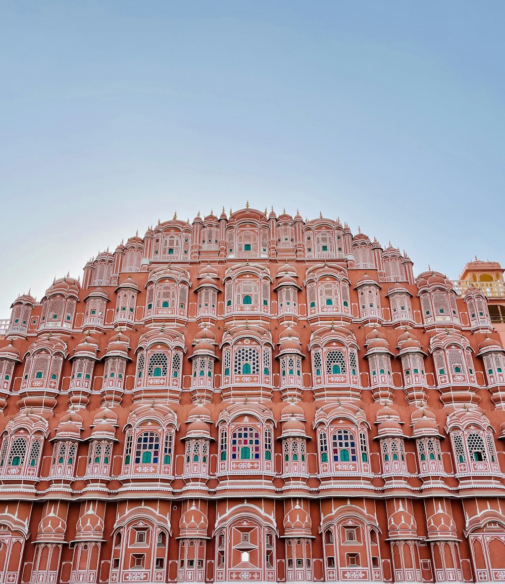 a very tall building with many windows and balconies