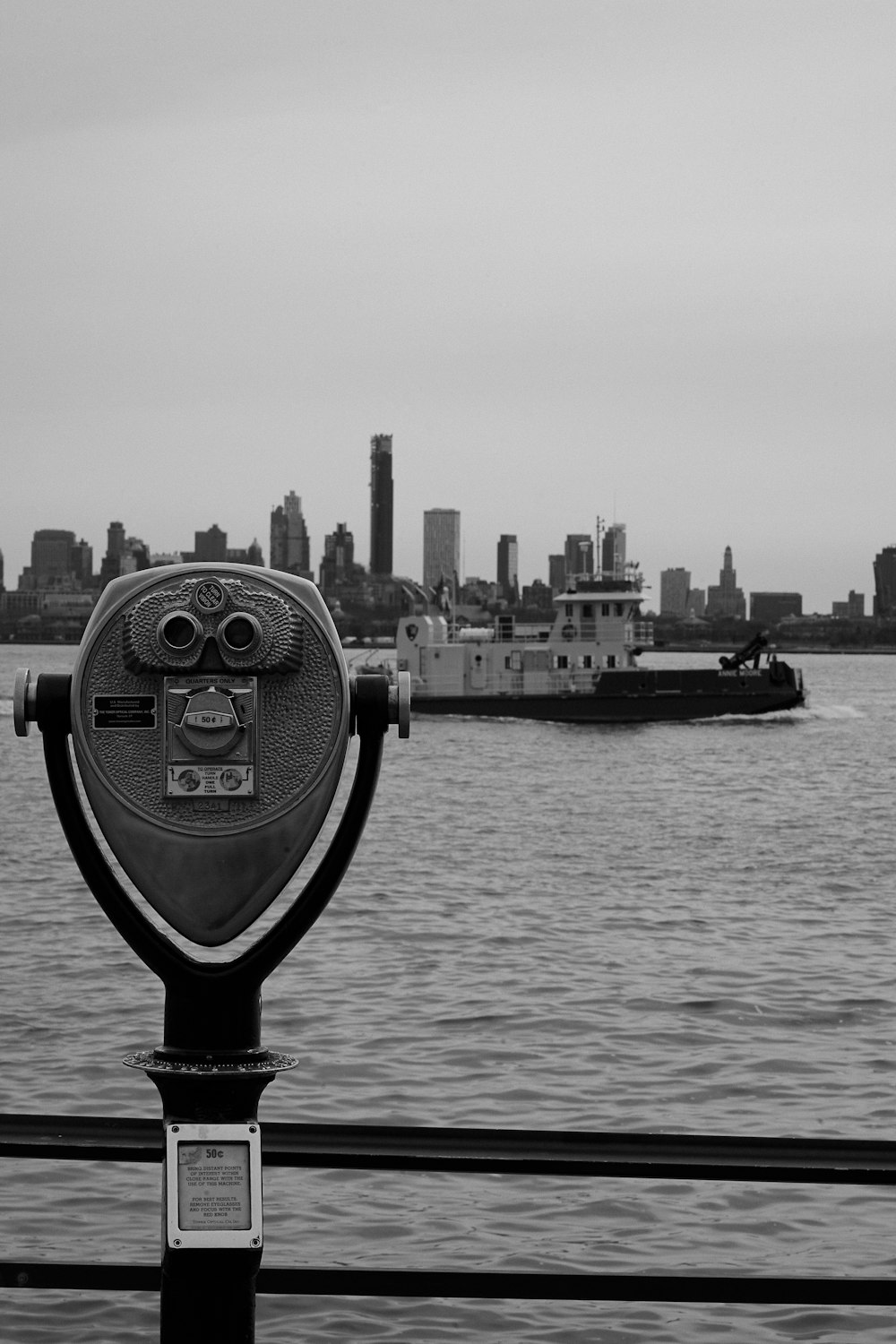 a black and white photo of a boat in the water