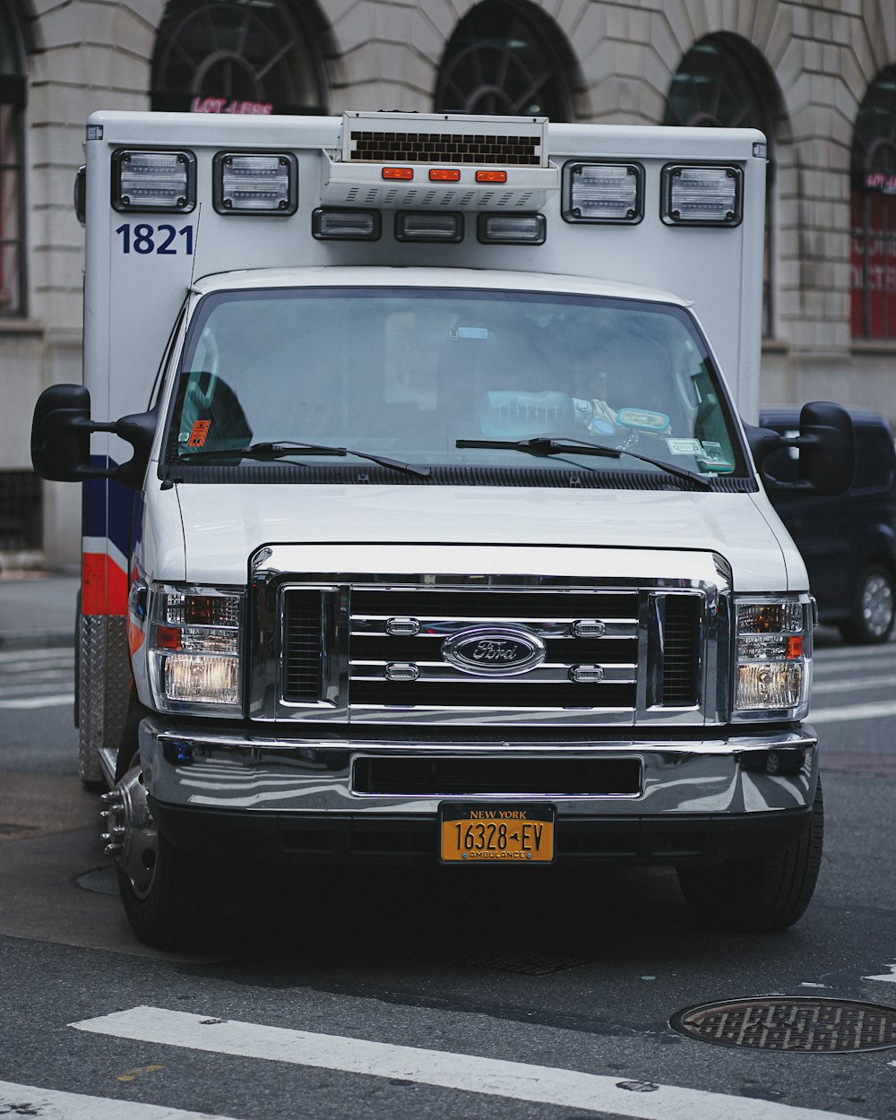 an ambulance parked on the side of the road