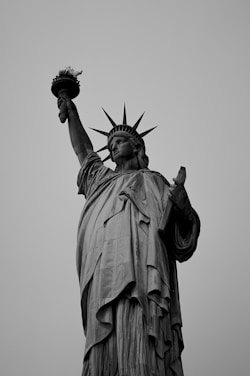 a black and white photo of the statue of liberty