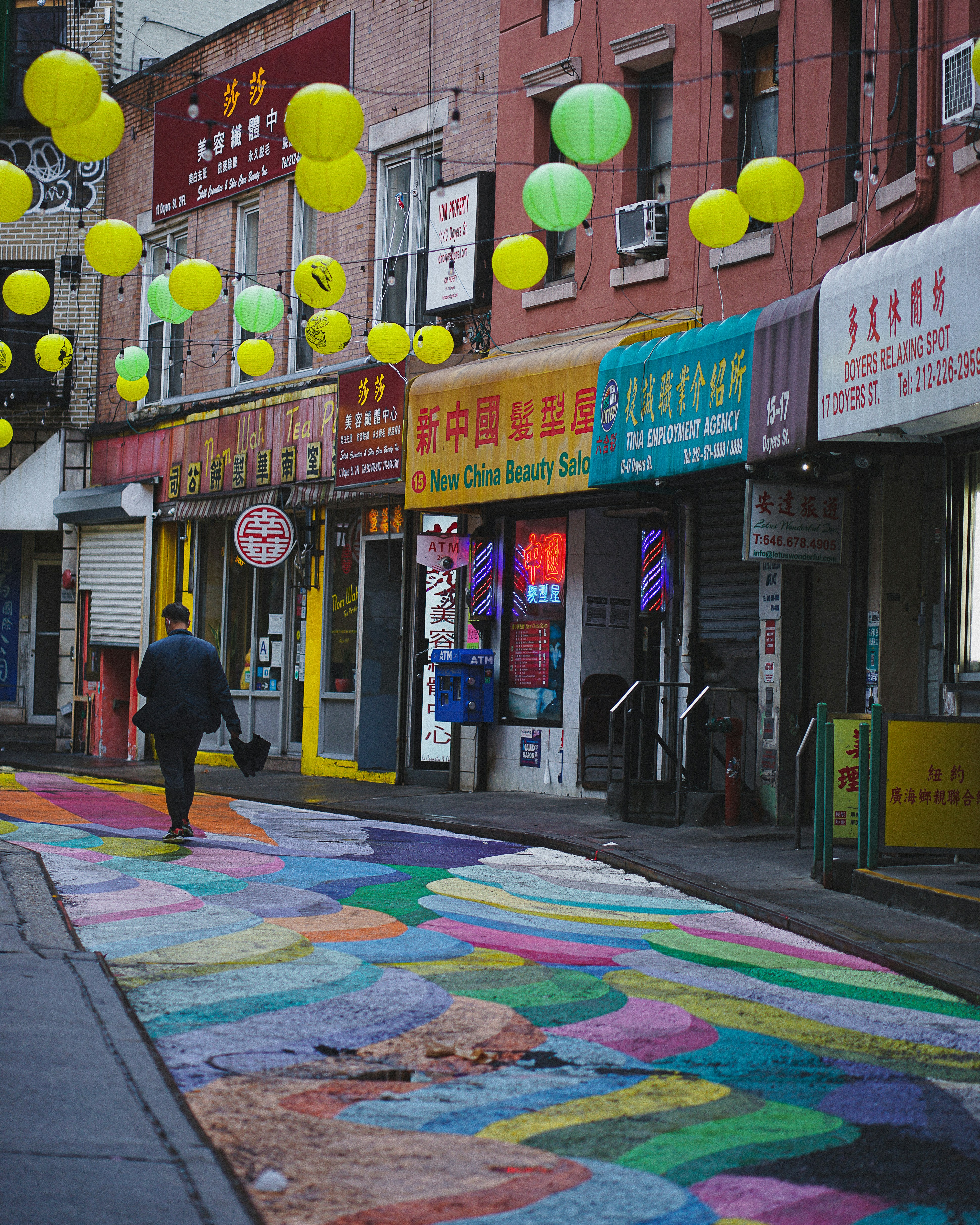 Watercolor painting of a bustling street in Tainan, Taiwan, with traditional red brick buildings and people enjoying street food.