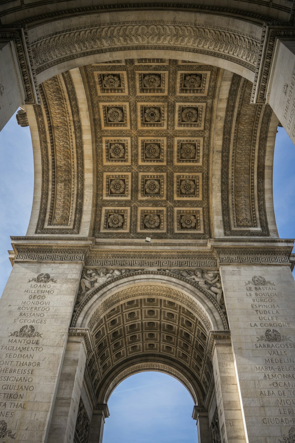 a very tall arch with a sky in the background