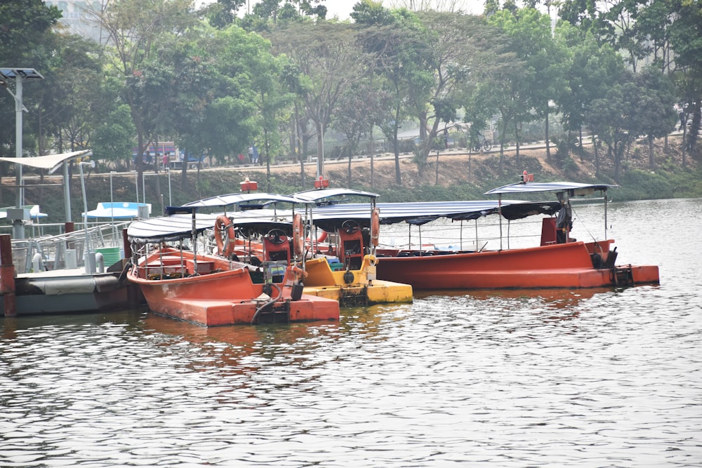 a group of boats floating on top of a lake