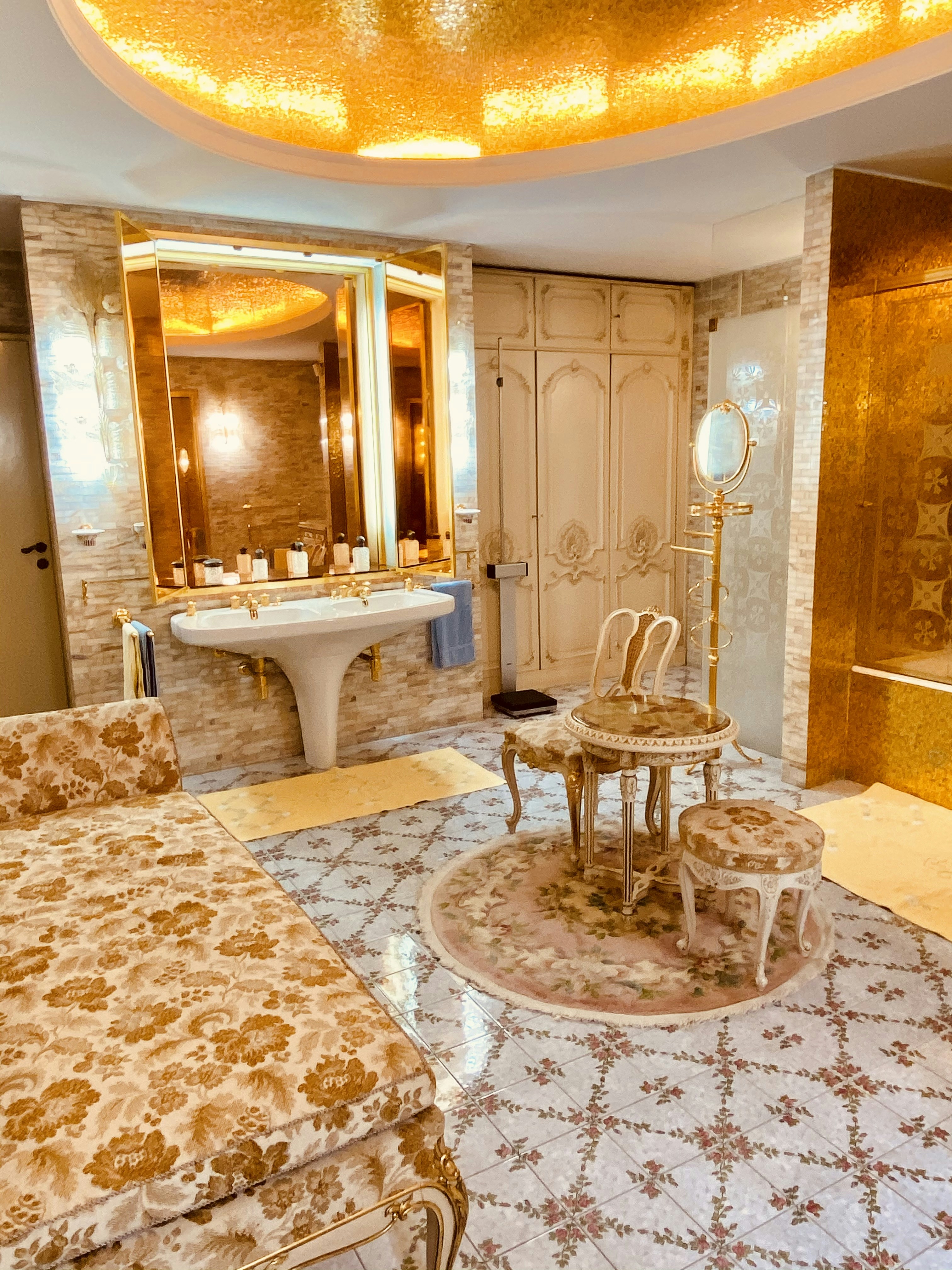 a fancy bathroom with a fancy bed and a fancy sink