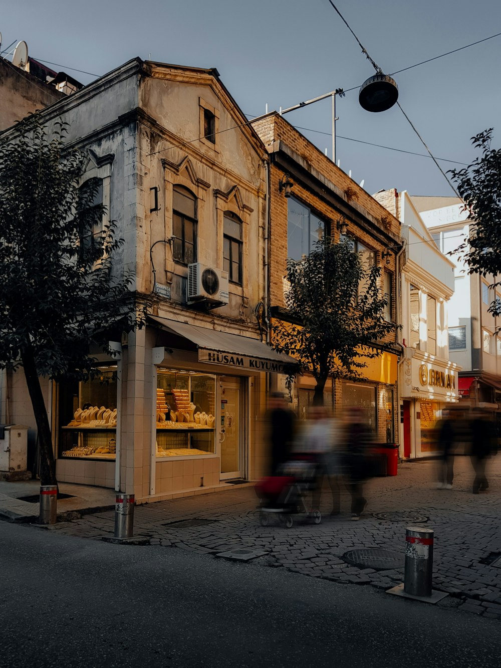 a blurry photo of people walking down a street