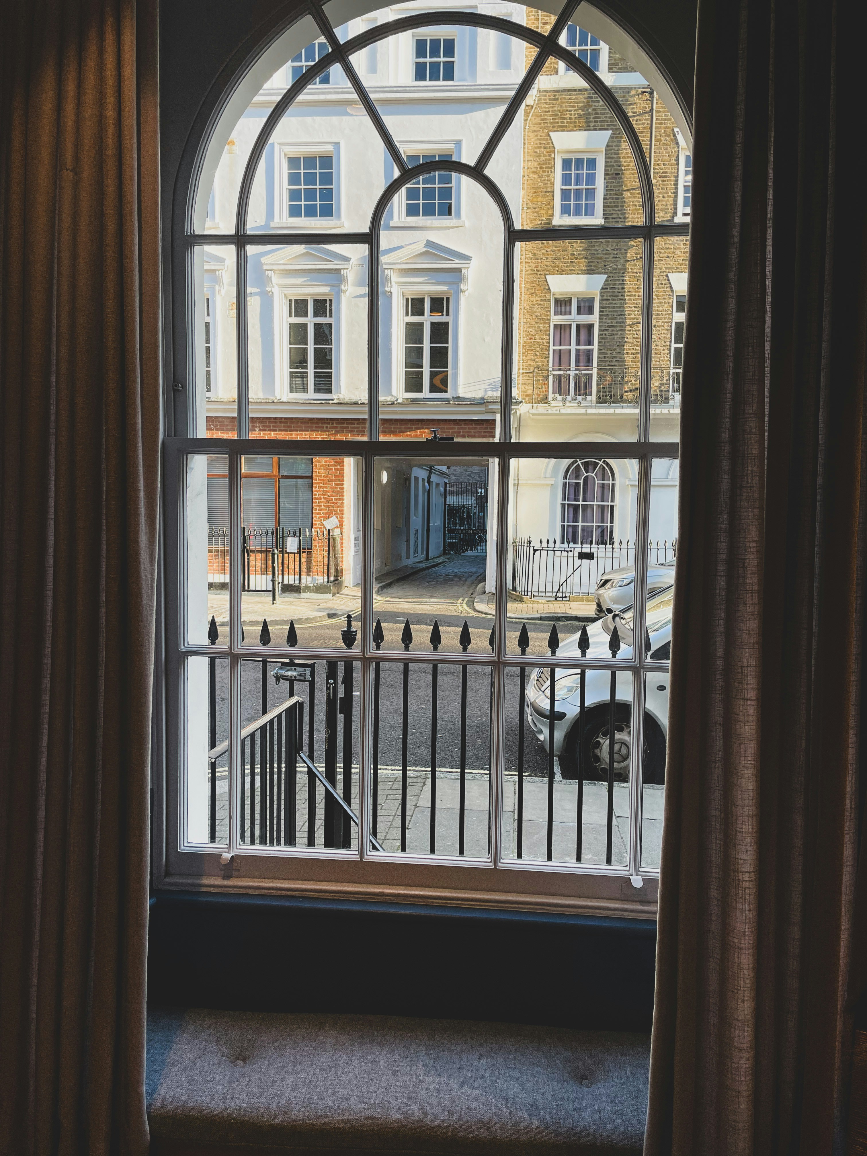A view of a street through a window photo – Free Architecture Image on ...